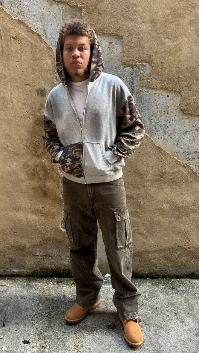 @shakurskii_ wearing Visionary Hills Concrete Jungle Zip Up